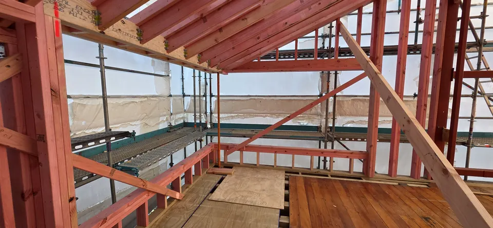 New timber framing around the window openings