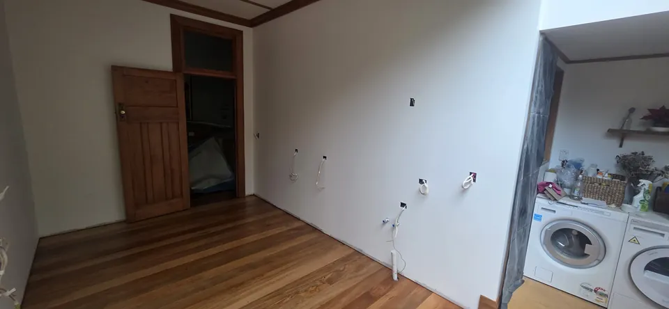 Restored room with timber floor and original doorway